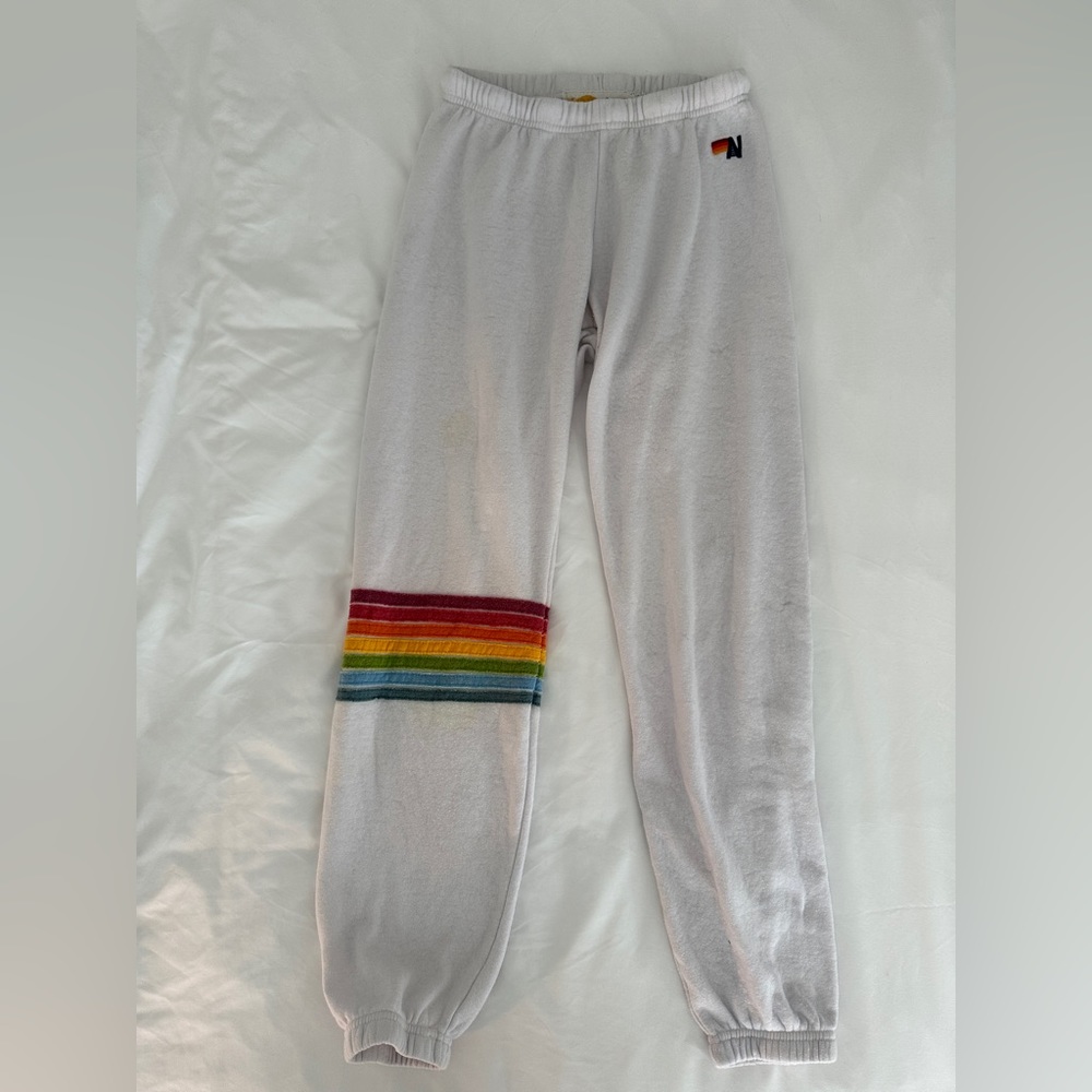 White aviator nation sweatpants with rainbow cuff